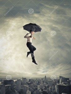 man-jumping-umbrella-under-him-there-s-city-31130656